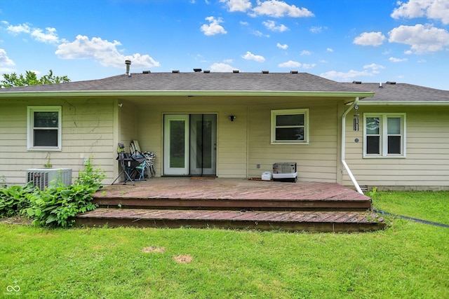 9002 Walton St, Indianapolis, IN 46231 - rear view of property featuring a wooden deck, a lawn, and central AC