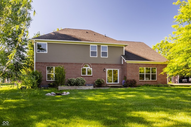 734 Richland Way, Westfield, IN 46074 - rear view of house with a lawn, brick siding, and roof with shingles