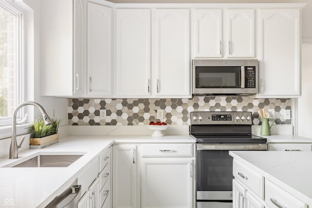 734 Richland Way, Westfield, IN 46074 - kitchen with stainless steel appliances, a sink, and white cabinets