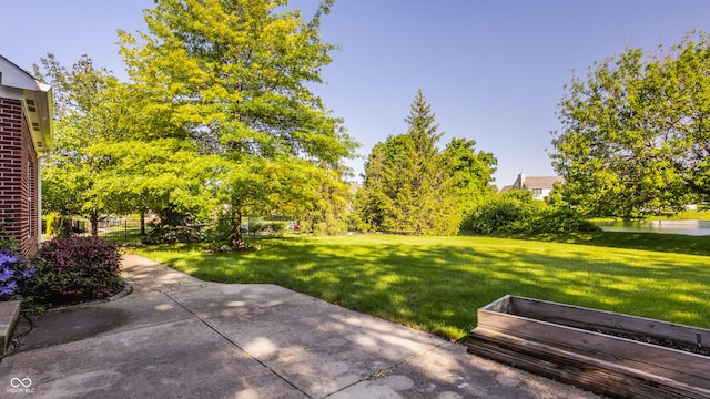 734 Richland Way, Westfield, IN 46074 - view of green lawn with a patio