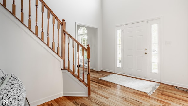 734 Richland Way, Westfield, IN 46074 - entrance foyer featuring hardwood / wood-style floors, baseboards, stairs, and a high ceiling