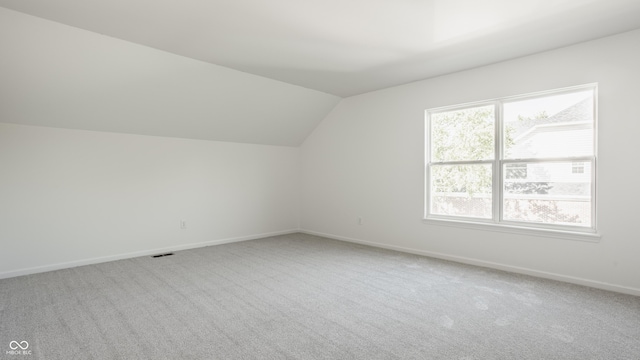734 Richland Way, Westfield, IN 46074 - additional living space with vaulted ceiling, carpet flooring, and baseboards