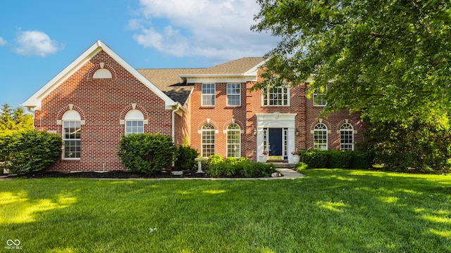 734 Richland Way, Westfield, IN 46074 - colonial house with brick siding, a front yard, and roof with shingles