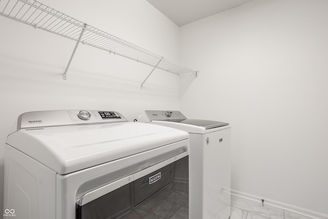734 Richland Way, Westfield, IN 46074 - laundry room featuring light marble finish floors, separate washer and dryer, and baseboards