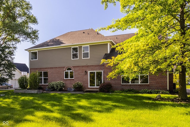 734 Richland Way, Westfield, IN 46074 - rear view of property with brick siding, a yard, and a shingled roof