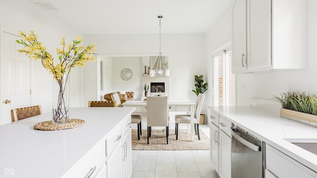 734 Richland Way, Westfield, IN 46074 - kitchen with stainless steel dishwasher, light marble finish flooring, white cabinetry, and light stone countertops