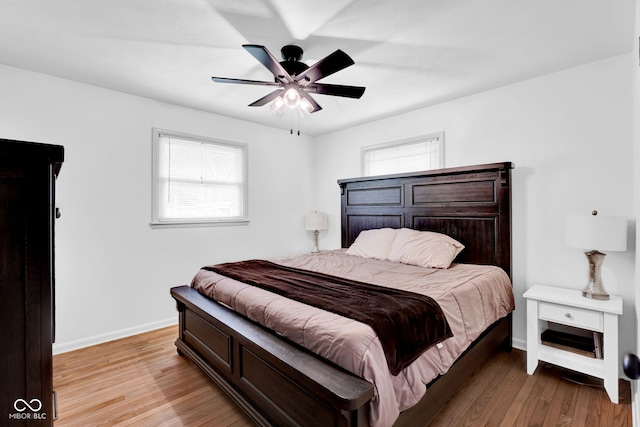 225 E Norris Hts, North Vernon, IN 47265 - bedroom with multiple windows, wood finished floors, baseboards, and ceiling fan
