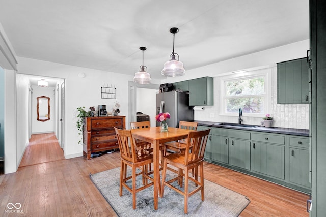 225 E Norris Hts, North Vernon, IN 47265 - dining space featuring light wood-style flooring and baseboards