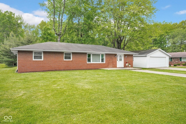 225 E Norris Hts, North Vernon, IN 47265 - ranch-style house featuring an outbuilding, a front lawn, brick siding, and concrete driveway