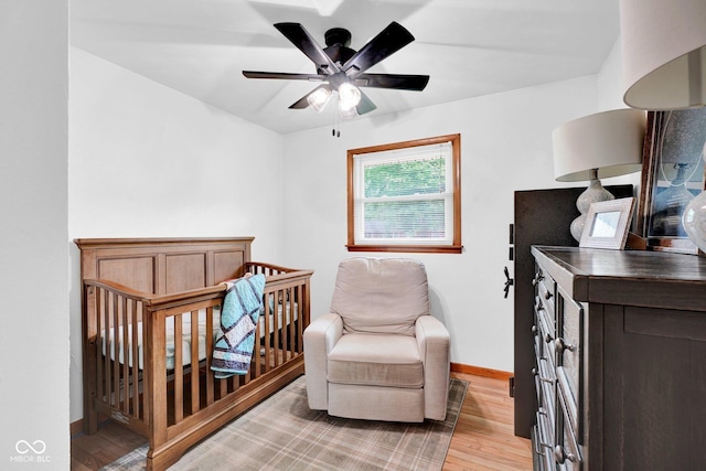 225 E Norris Hts, North Vernon, IN 47265 - bedroom with light wood-style floors, baseboards, and ceiling fan
