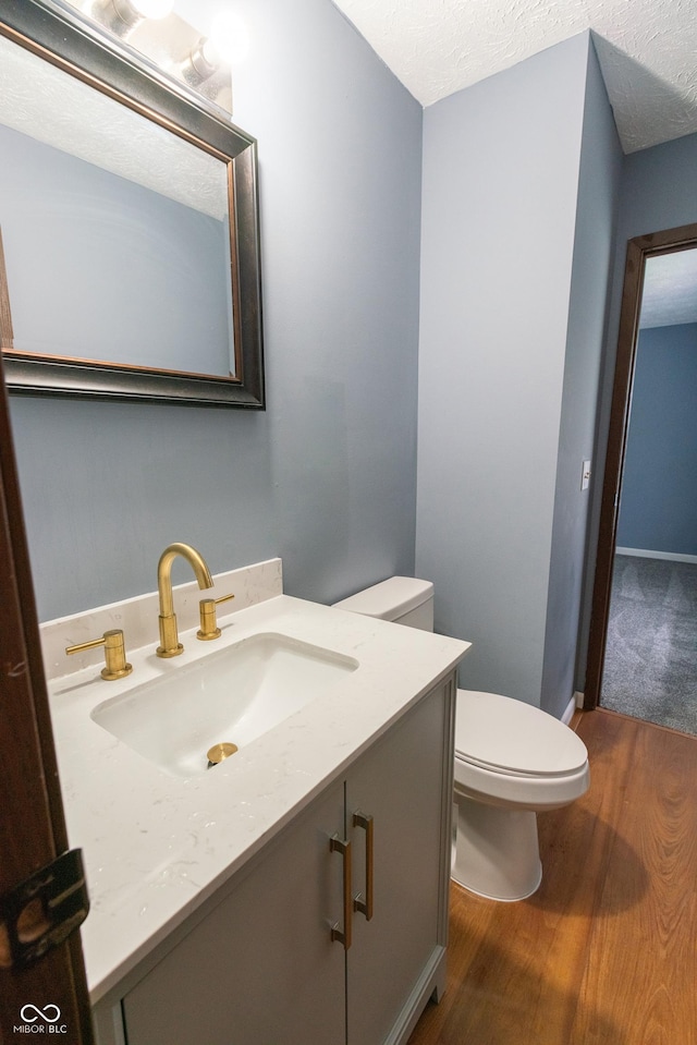 1708 Mason Dixon Dr S, West Lafayette, IN 47906 - bathroom with toilet, vanity, and wood finished floors