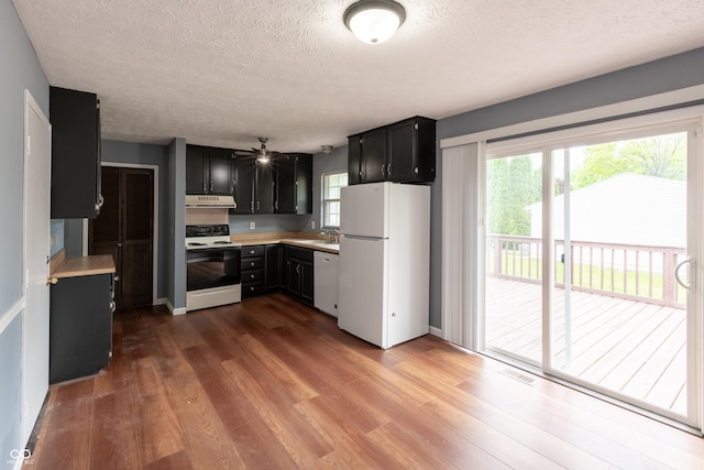 1708 Mason Dixon Dr S, West Lafayette, IN 47906 - kitchen featuring white appliances, under cabinet range hood, a textured ceiling, dark cabinetry, and light countertops