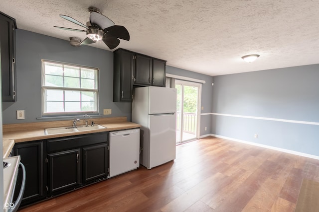 1708 Mason Dixon Dr S, West Lafayette, IN 47906 - kitchen featuring white appliances, a sink, wood finished floors, light countertops, and a ceiling fan