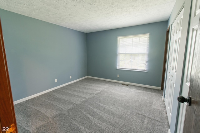 1708 Mason Dixon Dr S, West Lafayette, IN 47906 - unfurnished bedroom featuring carpet, a closet, baseboards, and a textured ceiling