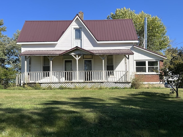 5855 S County Road 800 E, Coatesville, IN 46121 - farmhouse with a porch, a chimney, a front yard, and metal roof
