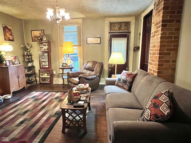 5855 S County Road 800 E, Coatesville, IN 46121 - living room with wood finished floors, a chandelier, a textured ceiling, and baseboards