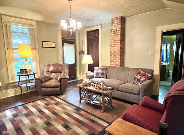 5855 S County Road 800 E, Coatesville, IN 46121 - living area featuring wood finished floors, a chandelier, a textured ceiling, and baseboards