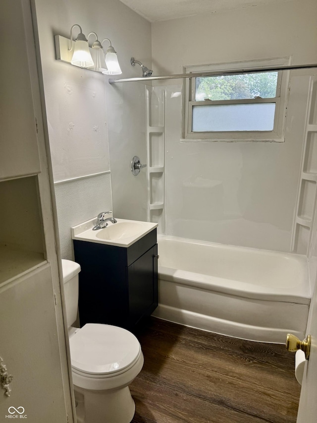 3325 Canaday Dr, Anderson, IN 46013 - bathroom featuring toilet, wood finished floors, vanity, and  shower combination