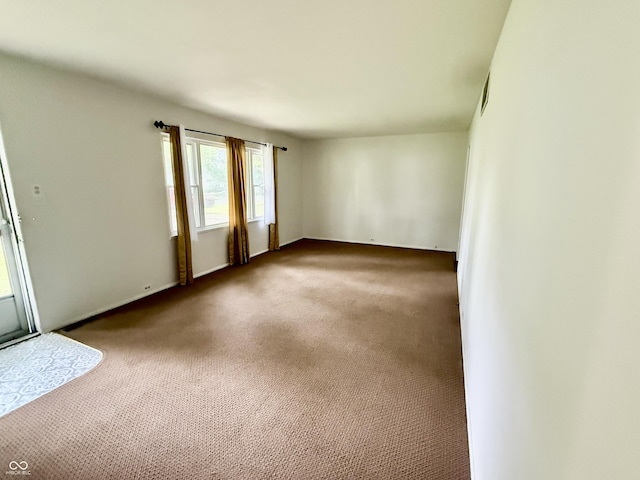 3325 Canaday Dr, Anderson, IN 46013 - spare room featuring carpet flooring and baseboards
