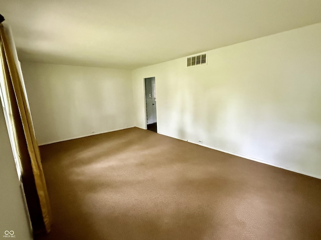 3325 Canaday Dr, Anderson, IN 46013 - empty room featuring dark colored carpet