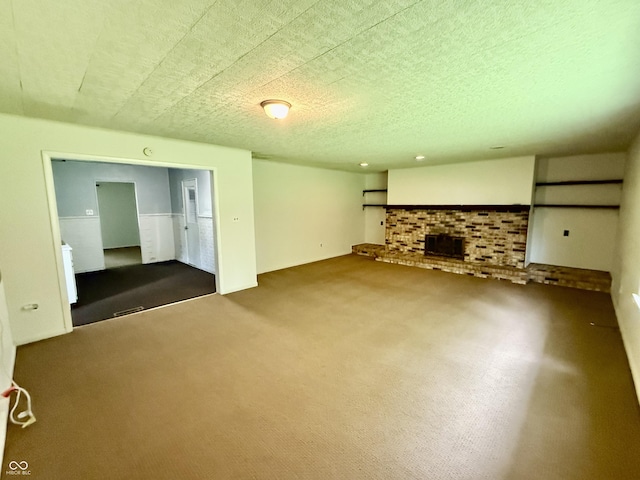 3325 Canaday Dr, Anderson, IN 46013 - unfurnished living room with carpet, a fireplace, and a textured ceiling