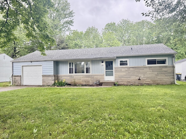 3325 Canaday Dr, Anderson, IN 46013 - ranch-style home featuring stone siding, roof with shingles, and a front lawn