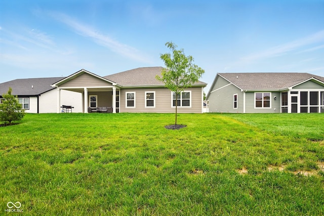 19257 Red Willow Ln, Noblesville, IN 46062 - back of house with a sunroom and a lawn