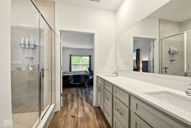 19257 Red Willow Ln, Noblesville, IN 46062 - full bathroom with ensuite bathroom, wood finished floors, a stall shower, and double vanity