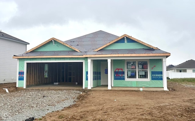 1170 Mcbride St, Greenfield, IN 46140 - view of front of house with a garage, driveway, and a porch