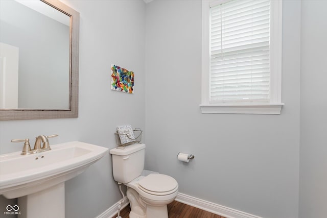 6337 Ederline Ln, Noblesville, IN 46062 - half bath with baseboards, wood finished floors, toilet, and a sink