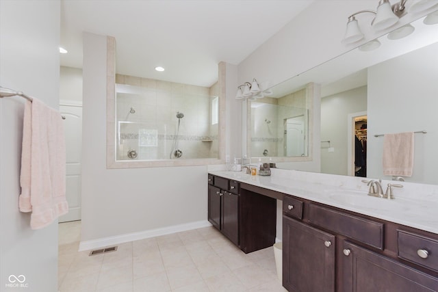 6337 Ederline Ln, Noblesville, IN 46062 - bathroom with walk in shower, double vanity, a walk in closet, tile patterned floors, and baseboards