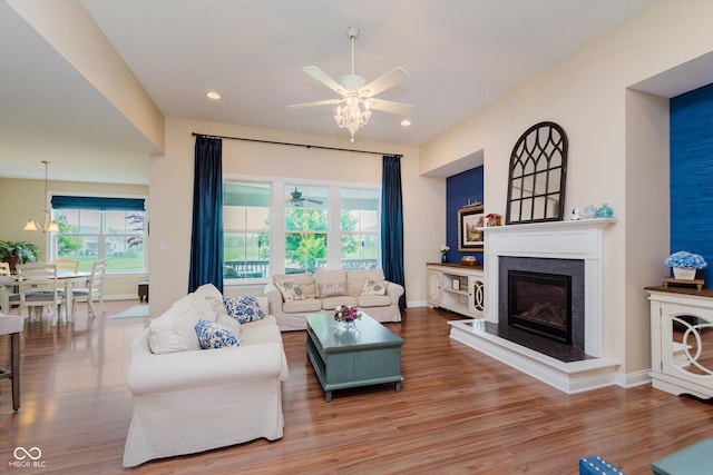 6337 Ederline Ln, Noblesville, IN 46062 - living room featuring ceiling fan, wood finished floors, healthy amount of natural light, a glass covered fireplace, and recessed lighting