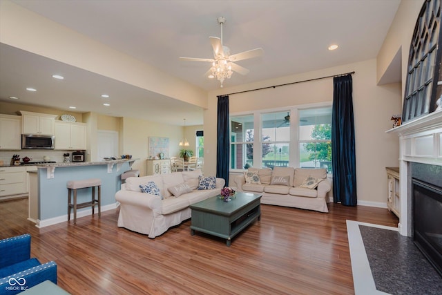 6337 Ederline Ln, Noblesville, IN 46062 - living room featuring ceiling fan, a fireplace, wood finished floors, recessed lighting, and baseboards