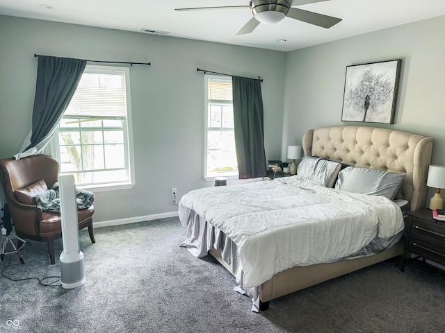 201 N Tacoma Ave, Indianapolis, IN 46201 - carpeted bedroom featuring multiple windows, baseboards, and ceiling fan