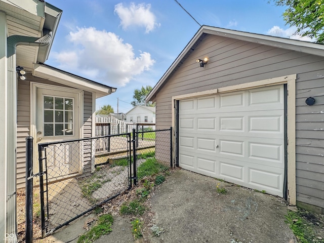 145 S 7th Ave, Beech Grove, IN 46107 - detached garage featuring asphalt driveway and a gate