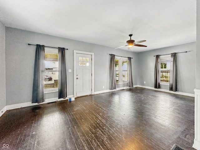 145 S 7th Ave, Beech Grove, IN 46107 - unfurnished living room with ceiling fan, wood-type flooring, and baseboards