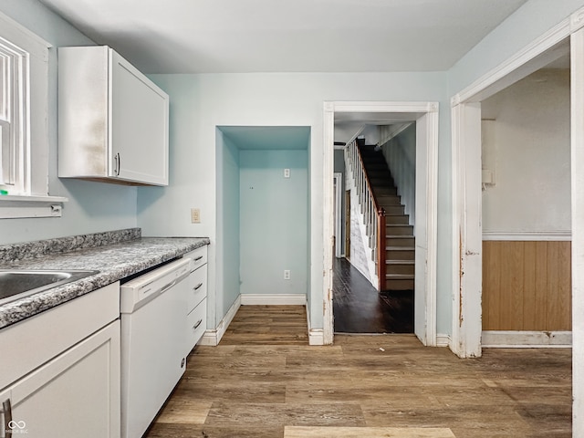 145 S 7th Ave, Beech Grove, IN 46107 - kitchen featuring dishwasher, wood finished floors, white cabinetry, and a sink