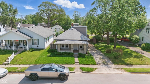 145 S 7th Ave, Beech Grove, IN 46107 - bungalow-style house featuring a porch and a front yard