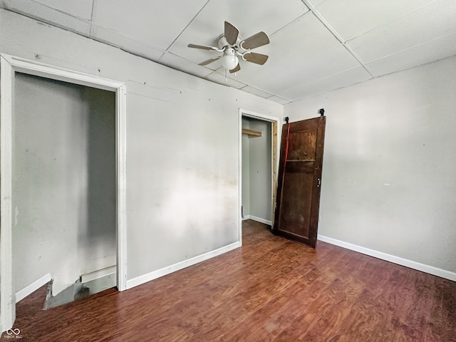 145 S 7th Ave, Beech Grove, IN 46107 - spare room with a paneled ceiling, ceiling fan, wood finished floors, and baseboards
