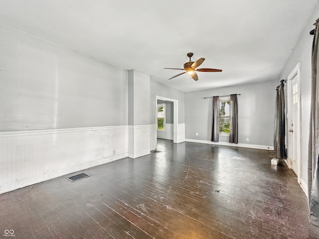 145 S 7th Ave, Beech Grove, IN 46107 - spare room with ceiling fan, a wainscoted wall, and hardwood / wood-style flooring