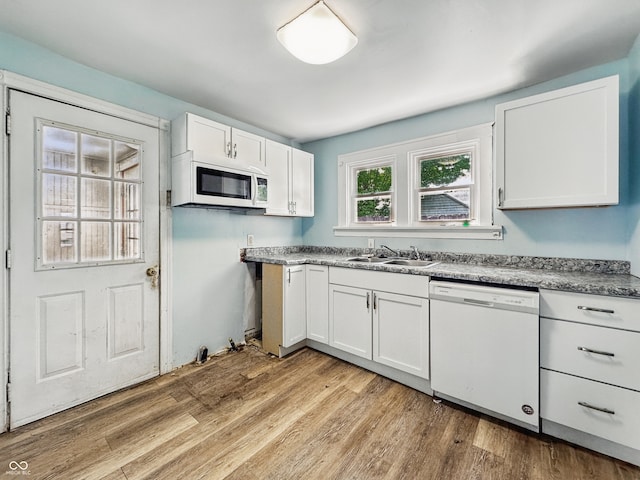 145 S 7th Ave, Beech Grove, IN 46107 - kitchen featuring white appliances, a sink, white cabinetry, and light wood finished floors