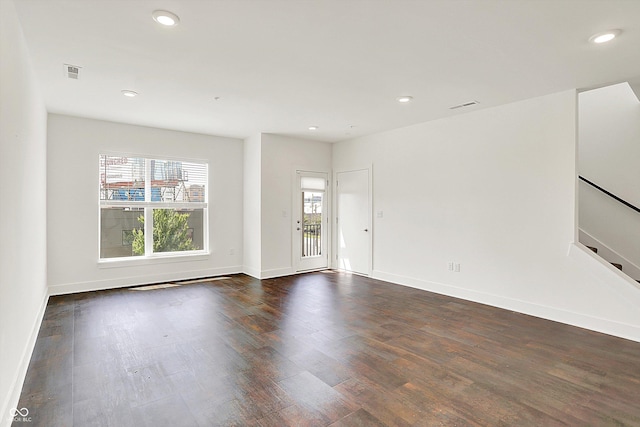 727 N Illinois St Unit 202, Indianapolis, IN 46204 - unfurnished living room featuring dark wood finished floors, recessed lighting, baseboards, and stairway