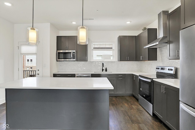727 N Illinois St Unit 202, Indianapolis, IN 46204 - kitchen featuring appliances with stainless steel finishes, wall chimney exhaust hood, backsplash, a sink, and recessed lighting