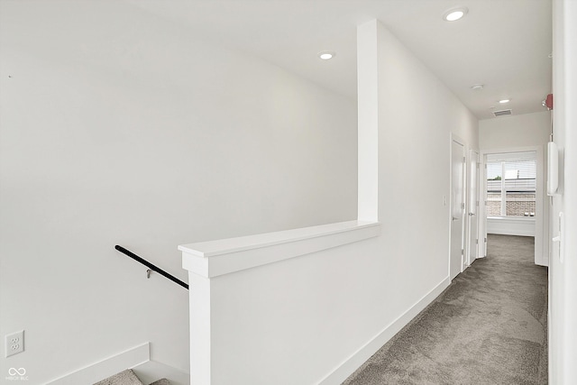 727 N Illinois St Unit 202, Indianapolis, IN 46204 - corridor with carpet floors, baseboards, recessed lighting, and an upstairs landing
