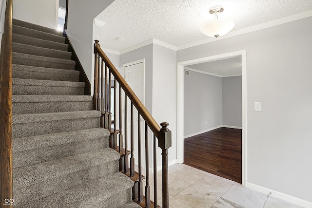 6838 Five Points Rd, Indianapolis, IN 46259 - stairs featuring tile patterned flooring, a textured ceiling, baseboards, and ornamental molding
