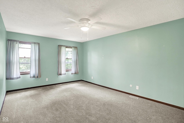 6838 Five Points Rd, Indianapolis, IN 46259 - carpeted spare room with ceiling fan, plenty of natural light, baseboards, and a textured ceiling
