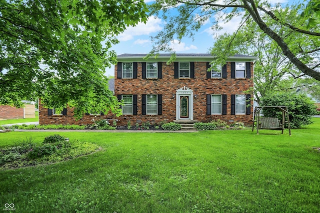 6838 Five Points Rd, Indianapolis, IN 46259 - colonial inspired home with a front yard and brick siding