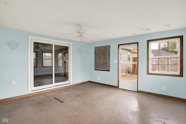 6838 Five Points Rd, Indianapolis, IN 46259 - unfurnished room featuring concrete floors, baseboards, and ceiling fan