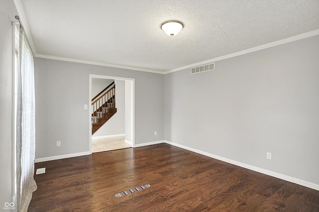 6838 Five Points Rd, Indianapolis, IN 46259 - empty room with a textured ceiling, wood finished floors, ornamental molding, baseboards, and stairway