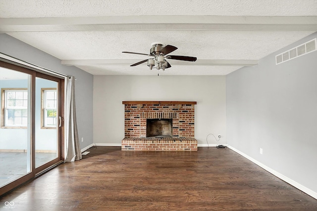 6838 Five Points Rd, Indianapolis, IN 46259 - unfurnished living room featuring beam ceiling, wood finished floors, a ceiling fan, baseboards, and a textured ceiling